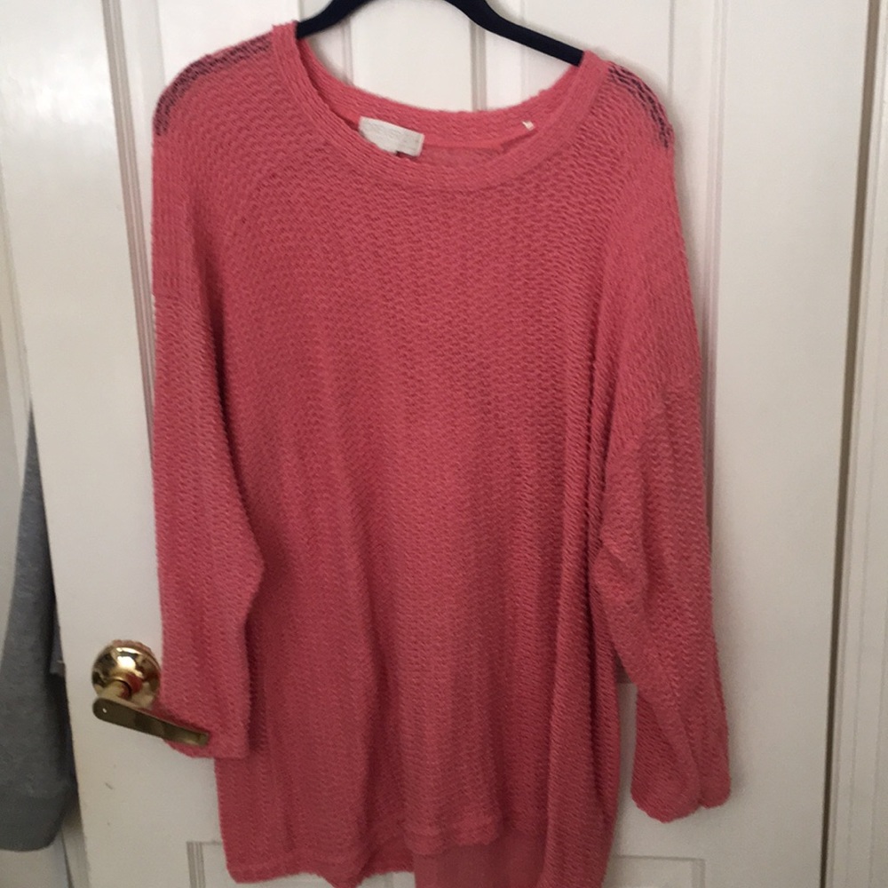 Knitted pink sweater.